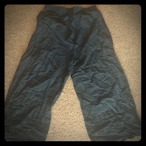 Black cotton pants with scallop cut outs at bottom